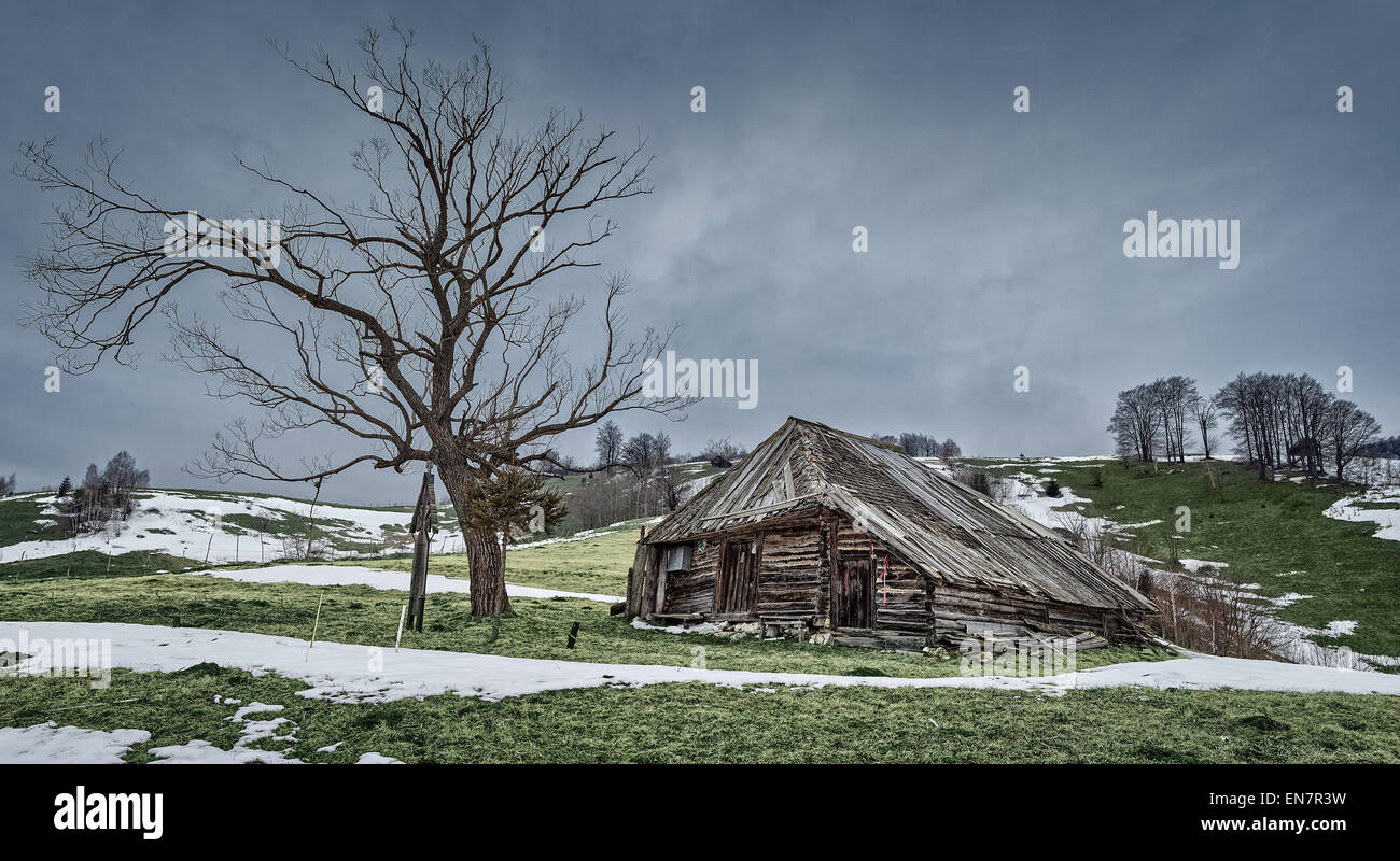 Winter landscape with an abandoned wooden house on the hills Stock ...