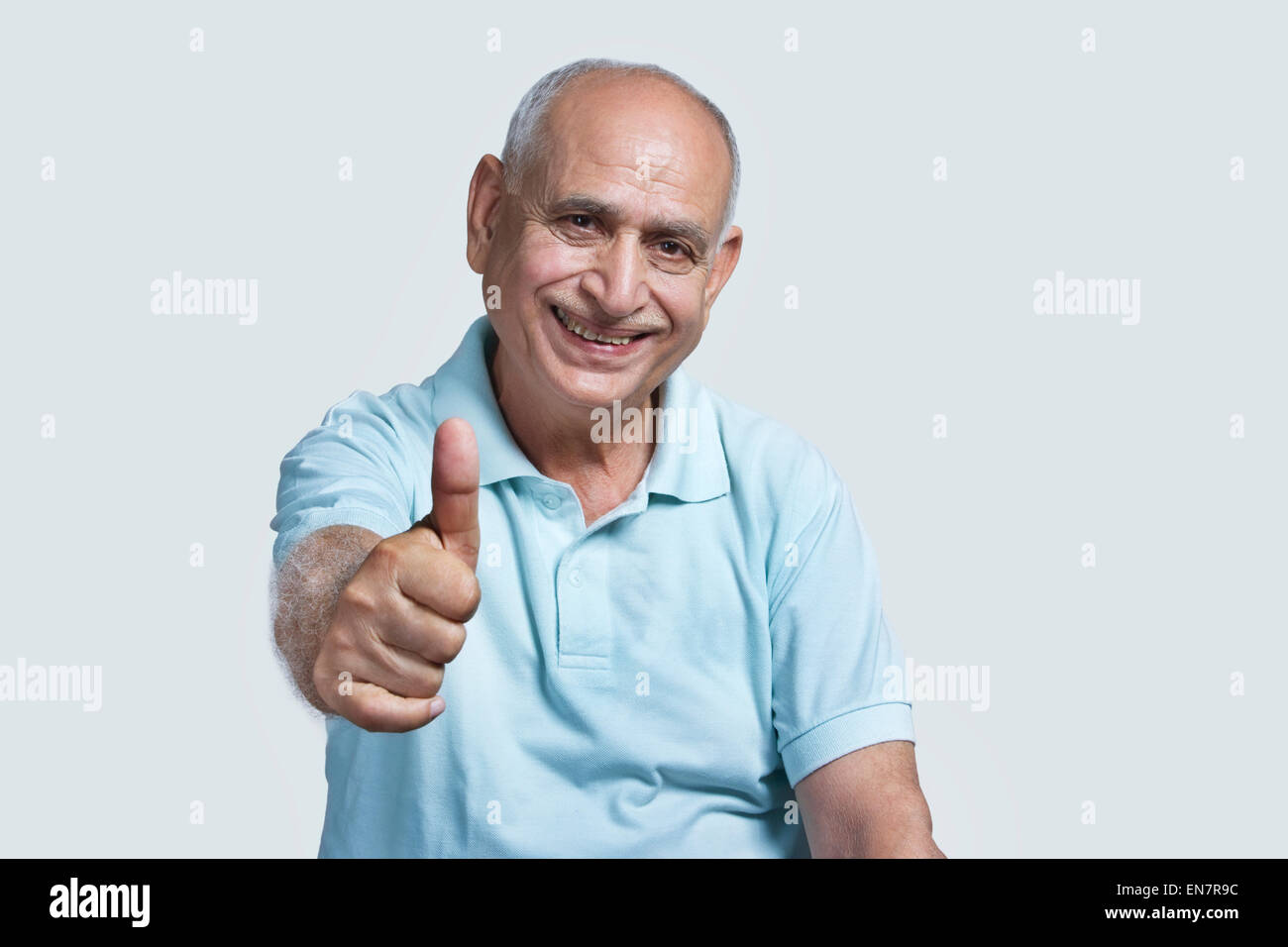 Old man giving thumbs up Stock Photo