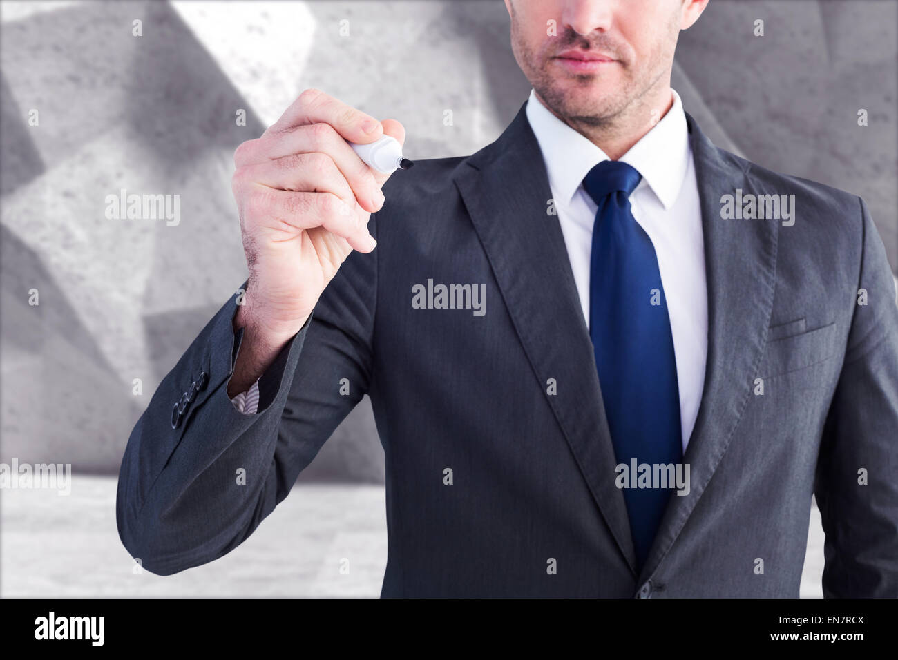 Composite image of serious businessman writing with marker Stock Photo ...