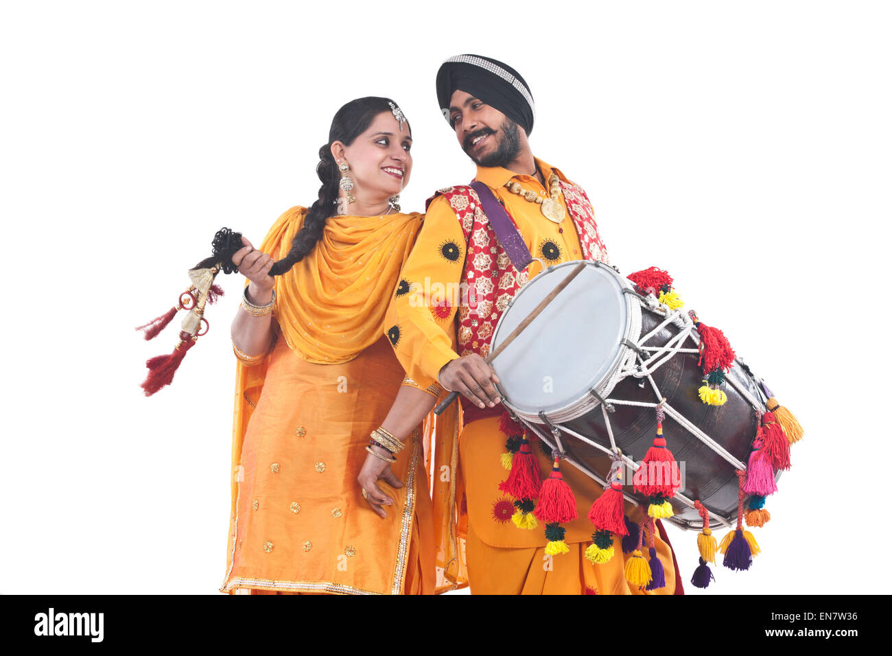 Sikh bhangra dancers standing back to back Stock Photo