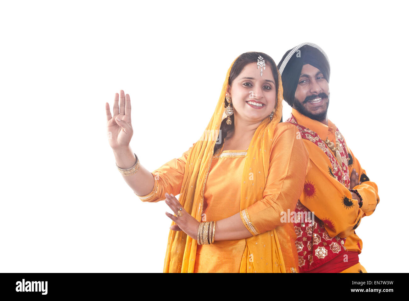 Portrait of Sikh couple standing back to back Stock Photo