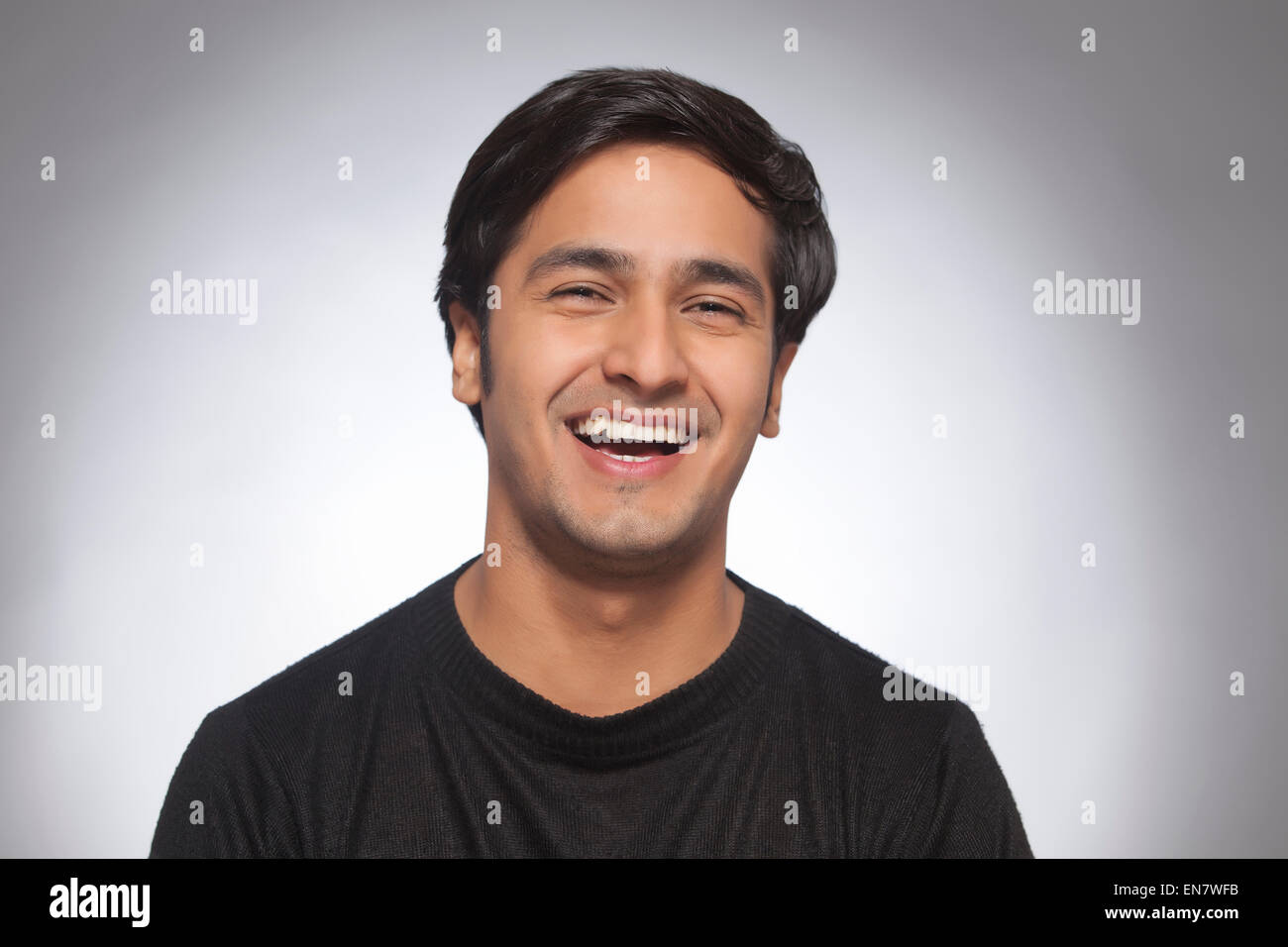 Young man looking up happy indian hi-res stock photography and images ...
