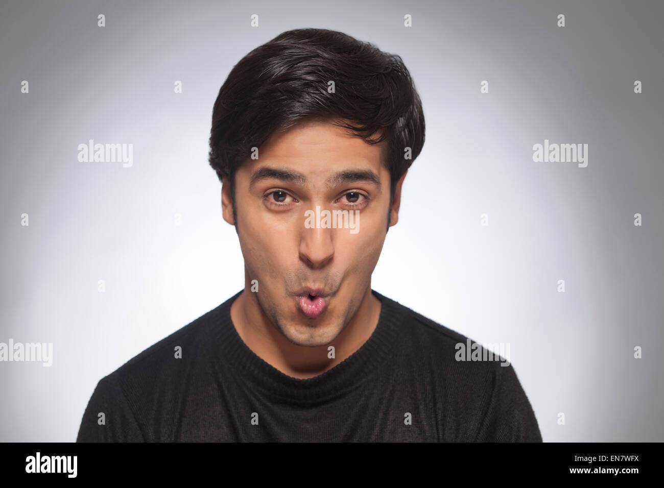 Portrait of a young man making a face Stock Photo