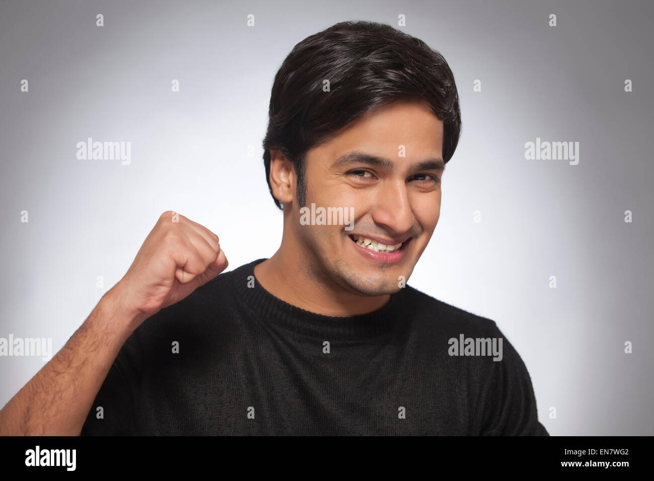 Posing head shot clenched fist hi-res stock photography and images - Alamy