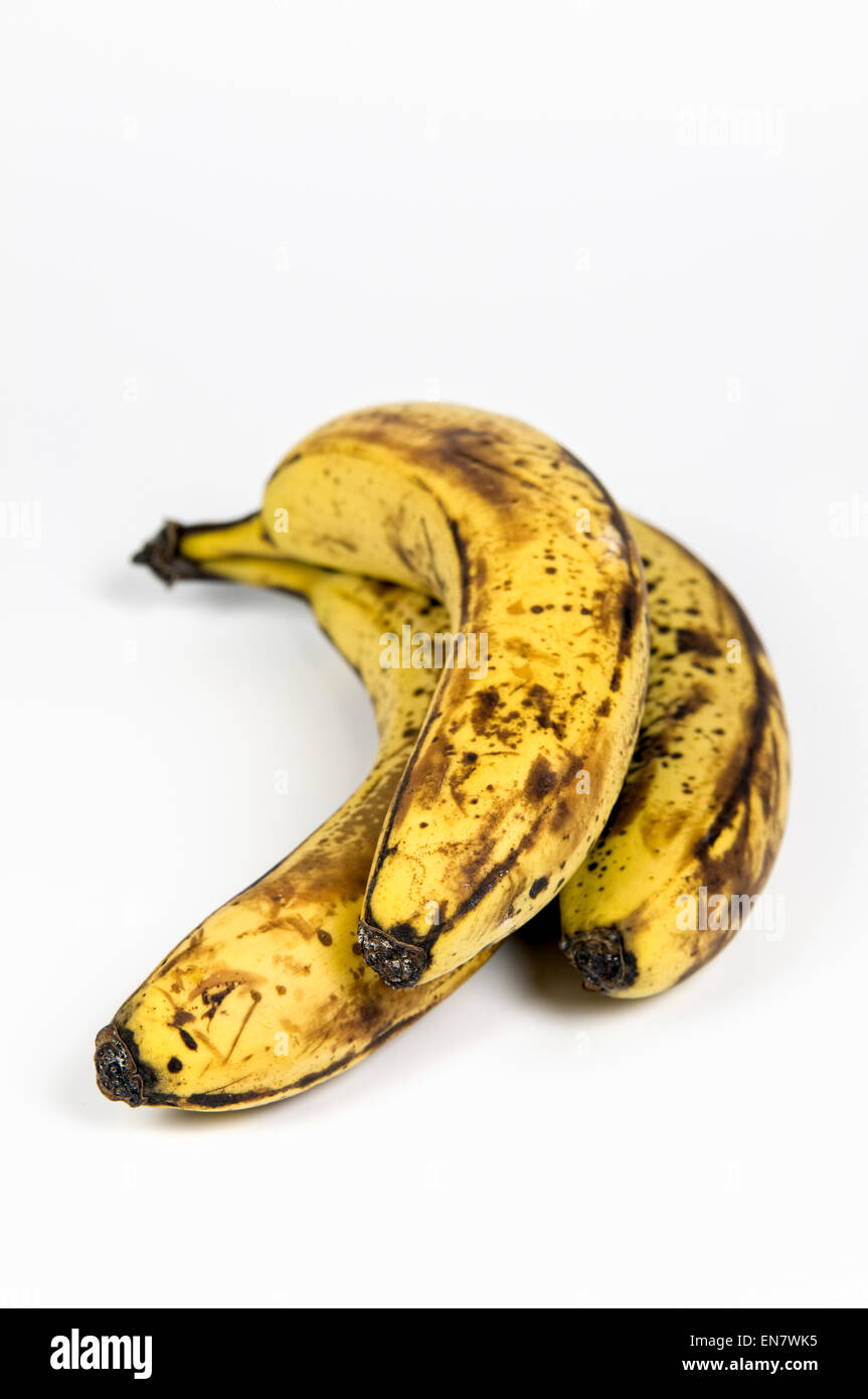 Overripe brown bananas on white background Stock Photo
