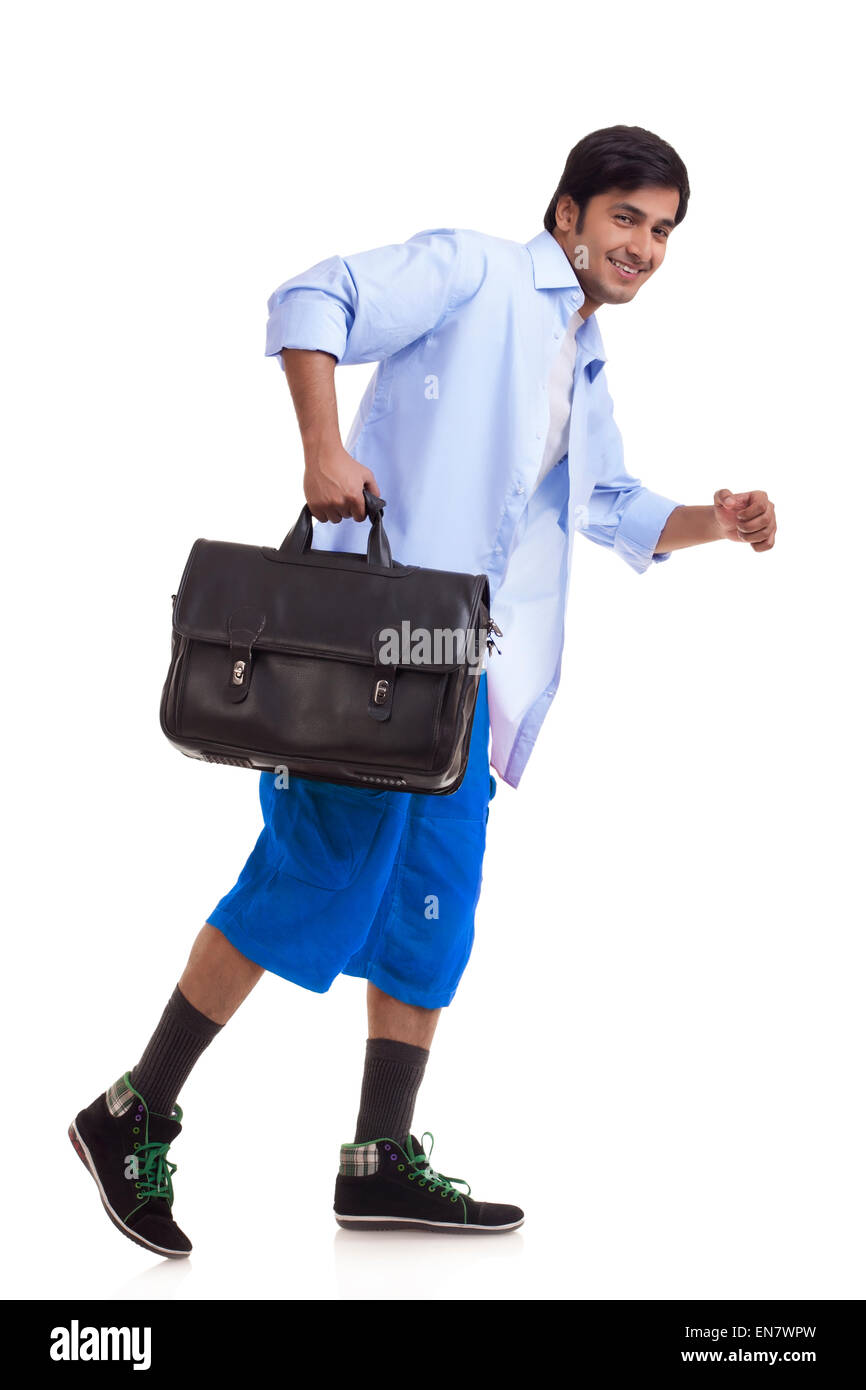 Young man on the go with briefcase Stock Photo