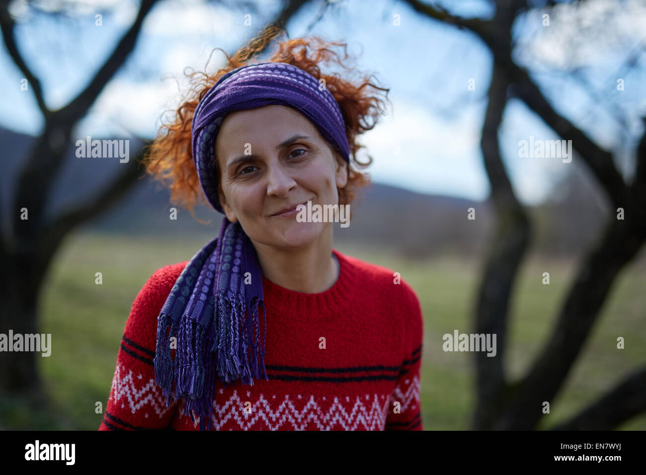 Closeup portrait of a caucasian peasant woman smiling outdoor Stock