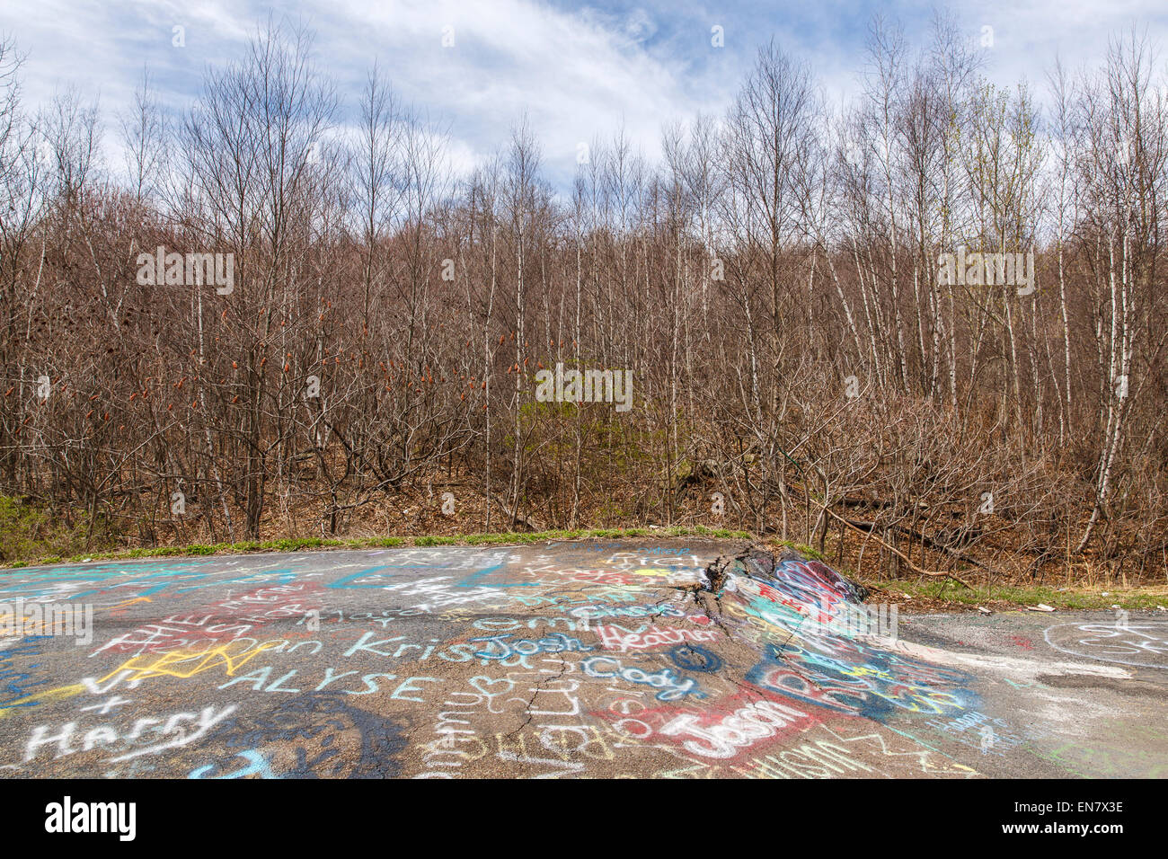 Subsidence cracks on Route 61 or Graffiti Highway in Centralia, PA where a mine fire that began in 1962 continues to burn to this day. Stock Photo