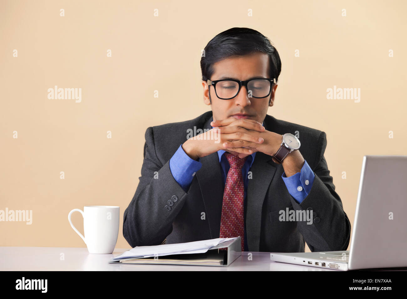 Businessman Sitting At Computer Desk Eyes Closed Stock Photo