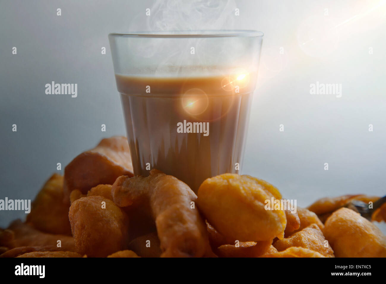 Glass of chai with an old fashioned kettle isolated over white background  Stock Photo - Alamy