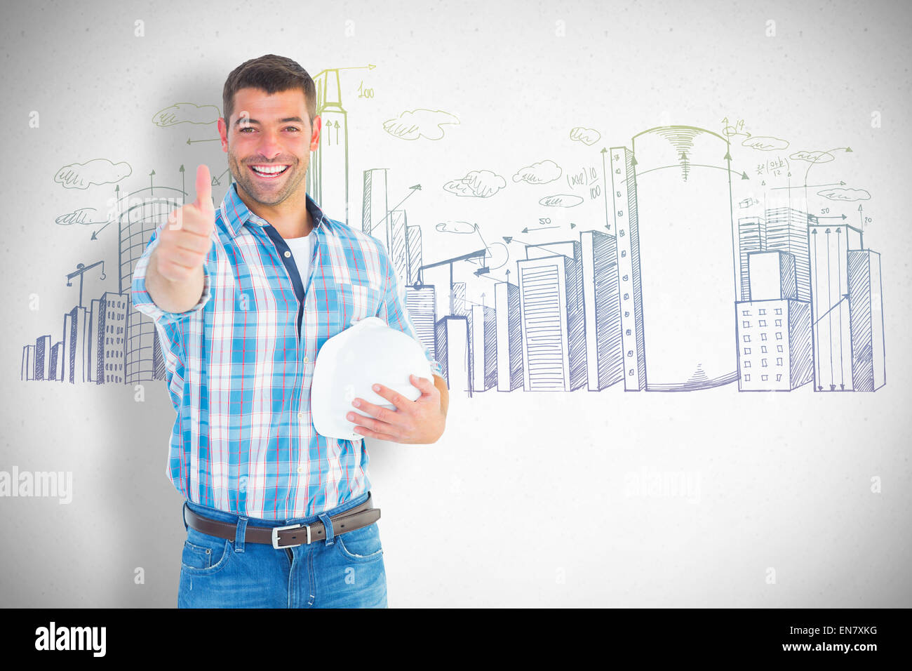 Composite image of confident manual worker gesturing thumbs up Stock Photo