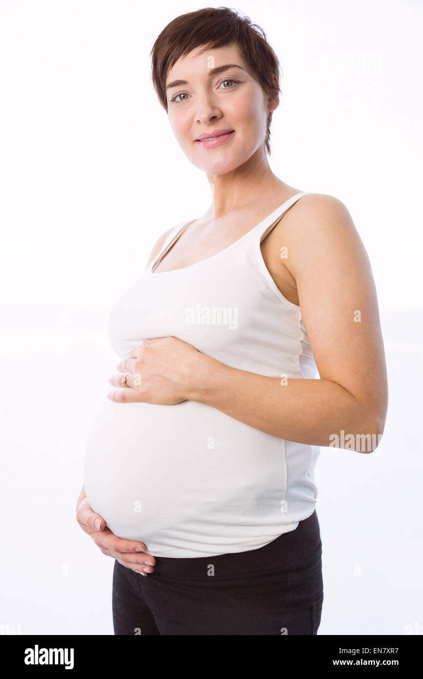 Pregnant woman holding her bump Stock Photo