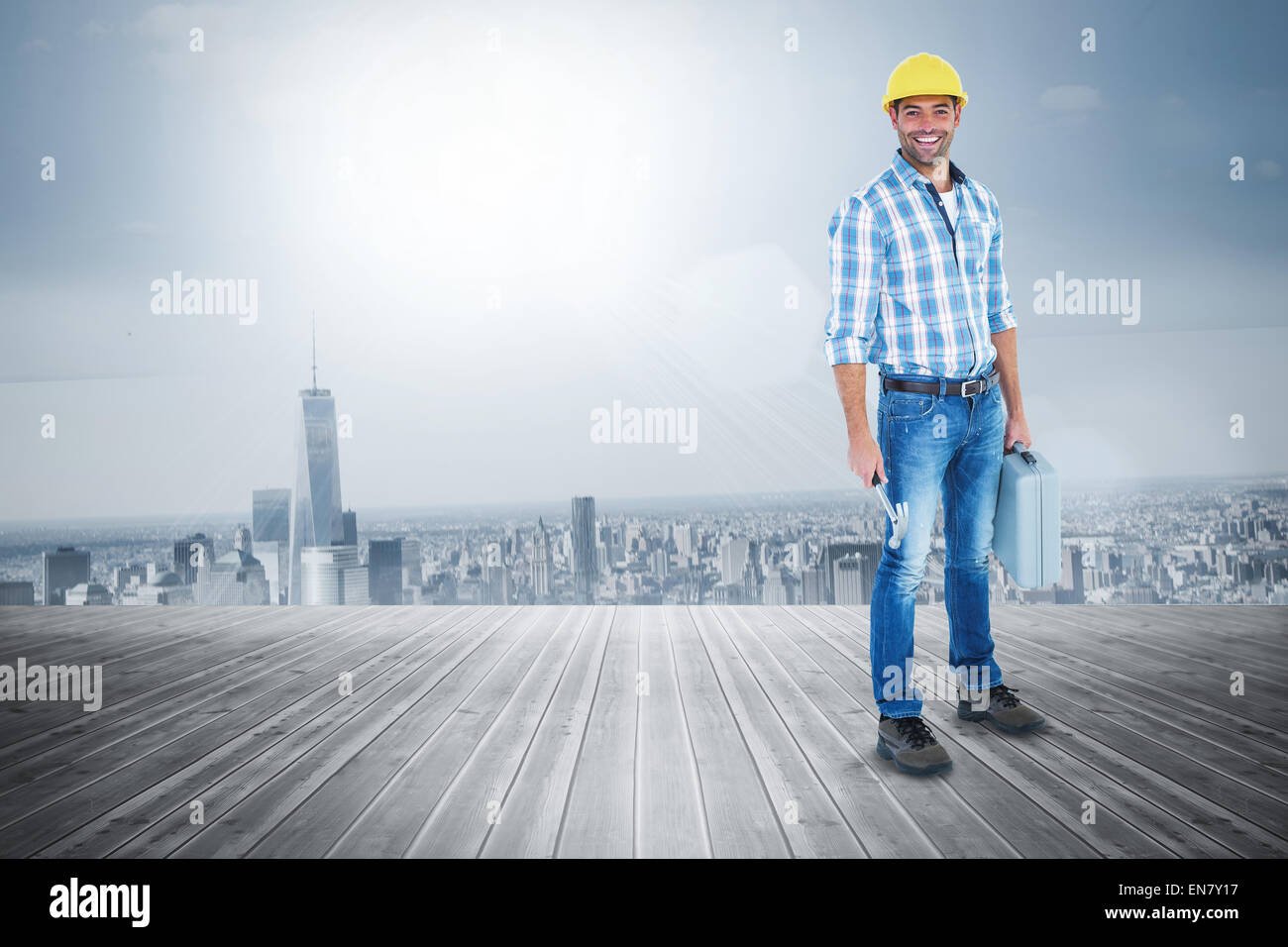 Composite image of manual worker with hammer and toolbox Stock Photo