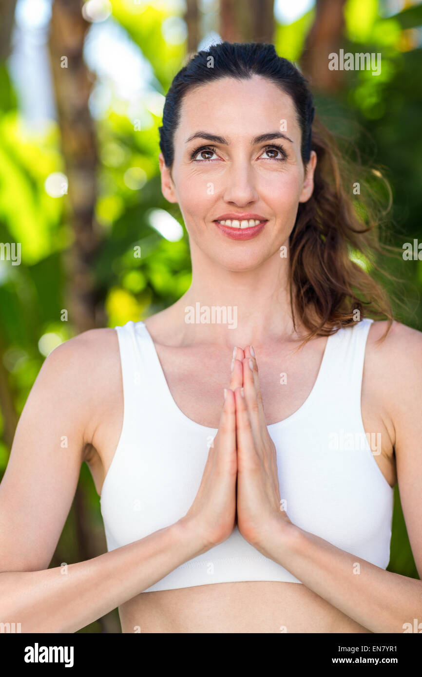 Sexy fit brunette woman in sportswear doing yoga exercises Stock Photo by  ©RVAS 77043615