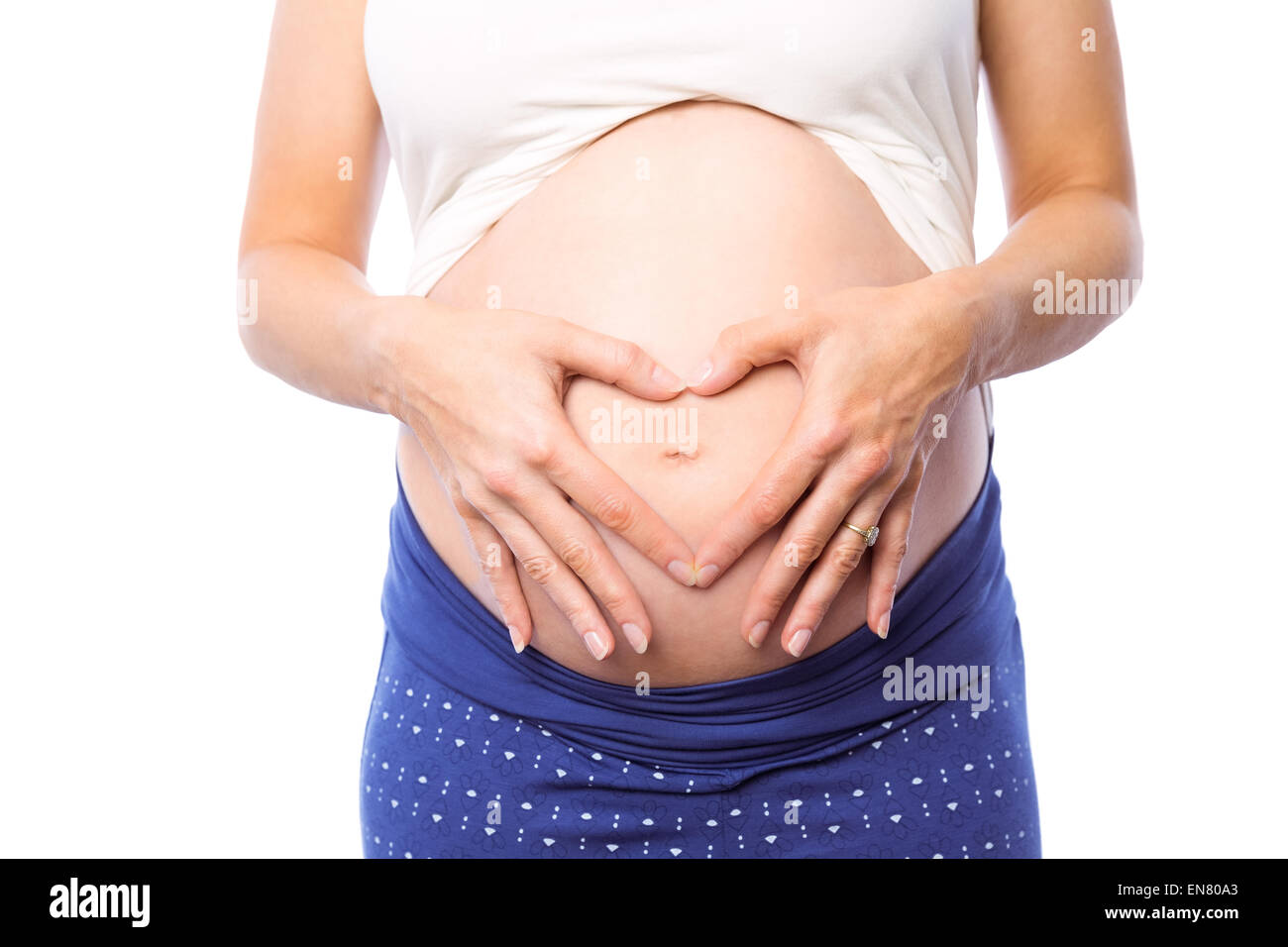 Pregnant woman holding her bump Stock Photo - Alamy