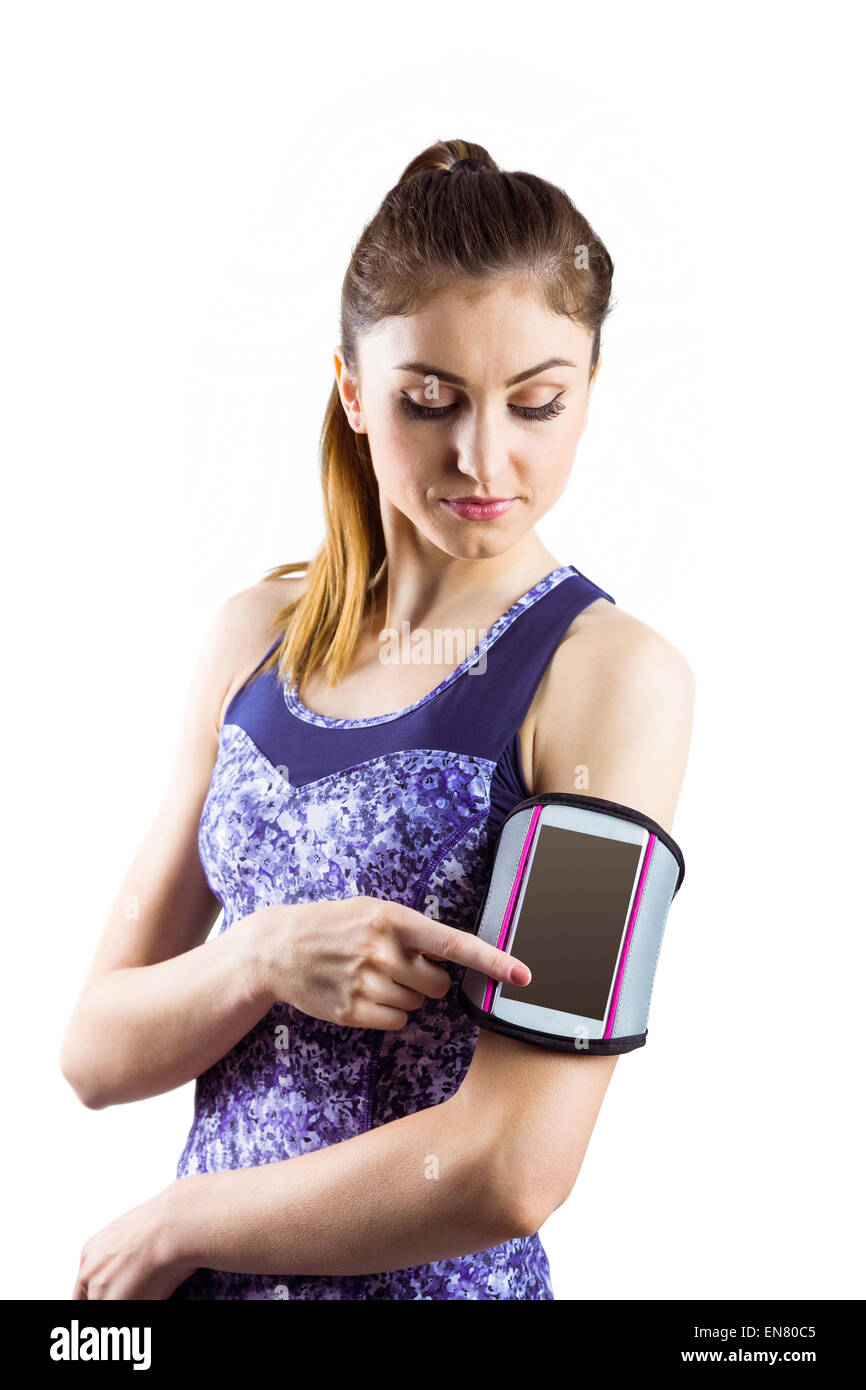 Fit woman using smartphone in armband Stock Photo