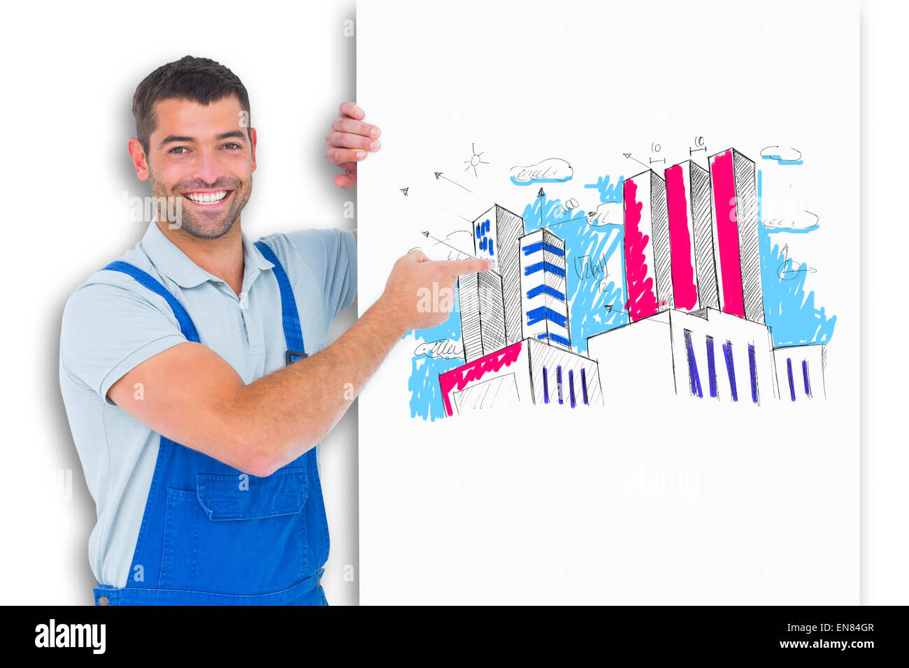 Composite image of repairman in overalls pointing at placard Stock Photo