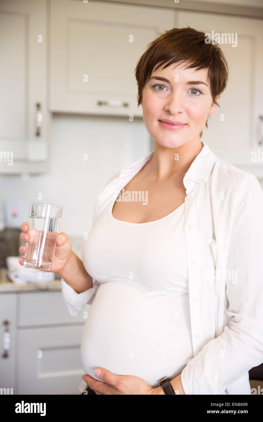 Pregnant woman having a glass of water Stock Photo Alamy