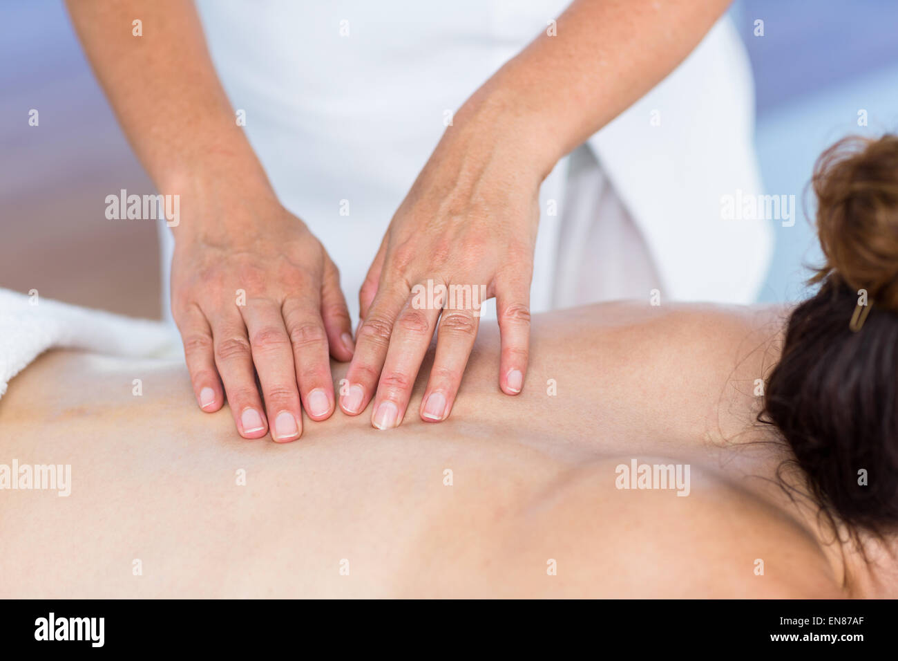 Brunette getting back massage Stock Photo