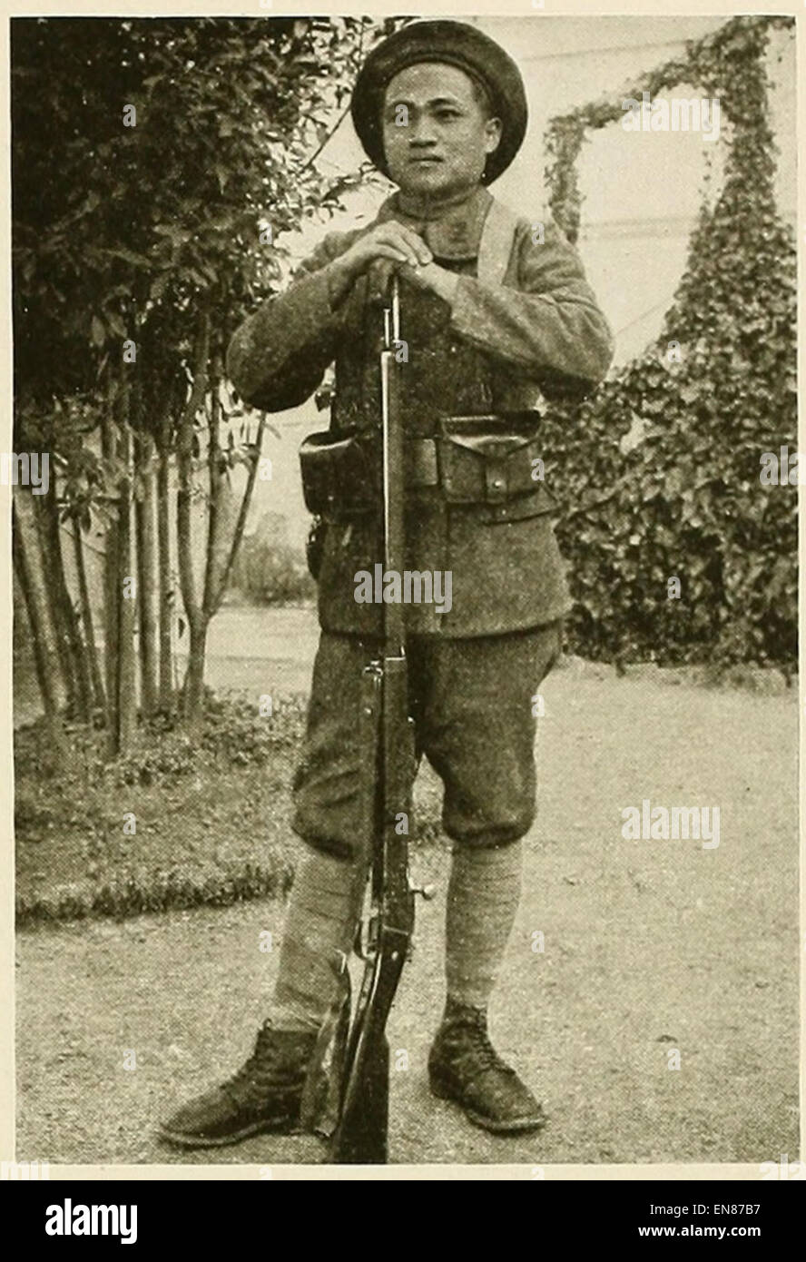A 1919 photograph depicting a Chinese soldier in France, showcasing his uniform and the historical context of Chinese participation in World War I. Stock Photo