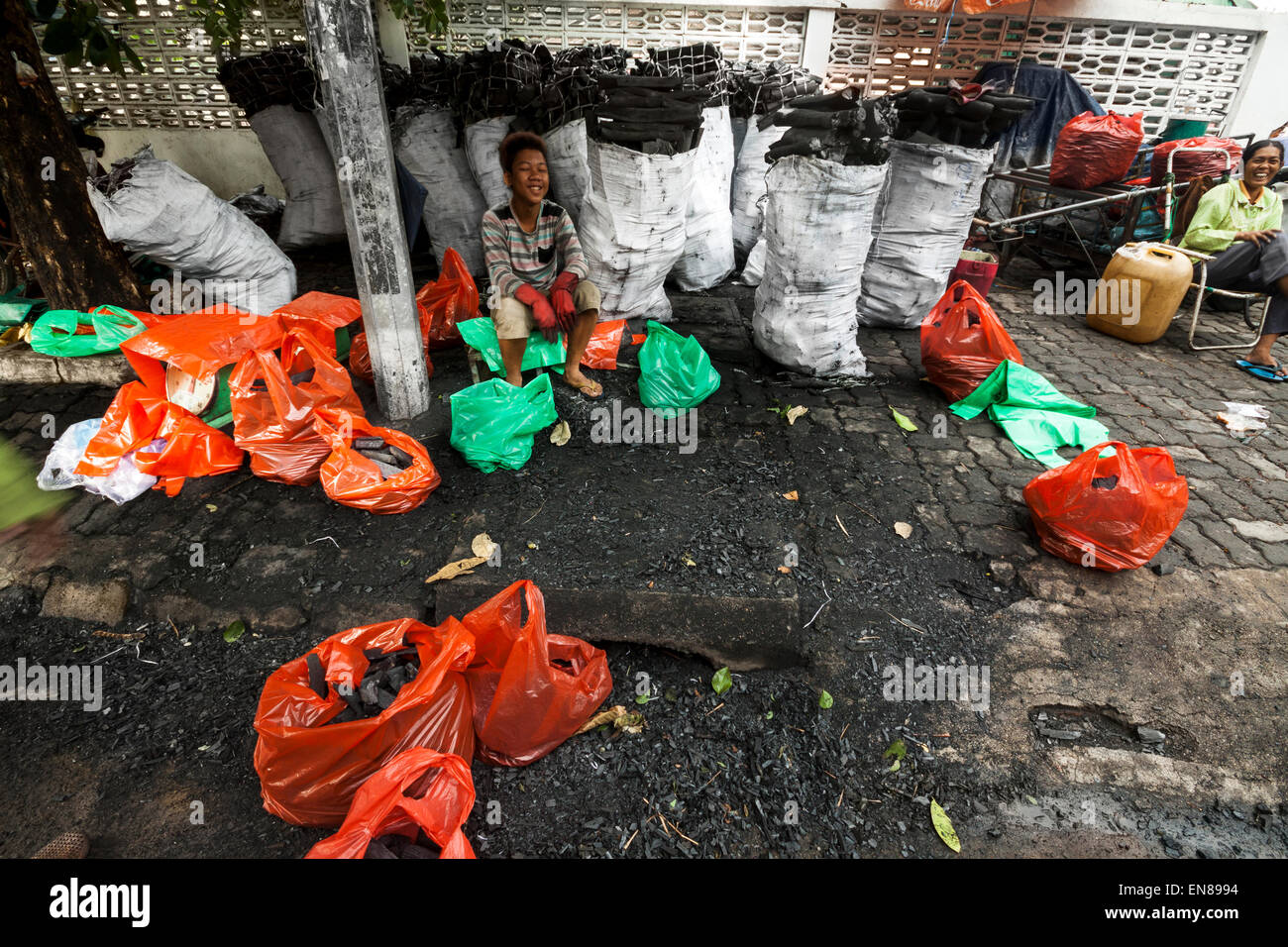 Cambodians sell charcoals on the street in Phnom Pen, Cambodia, Asia. Stock Photo