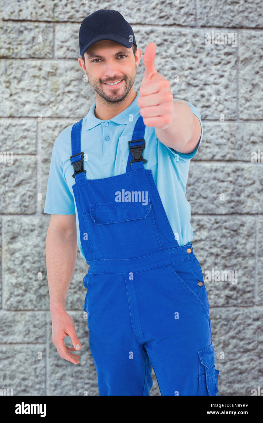 Composite image of repairman gesturing thumbs up Stock Photo