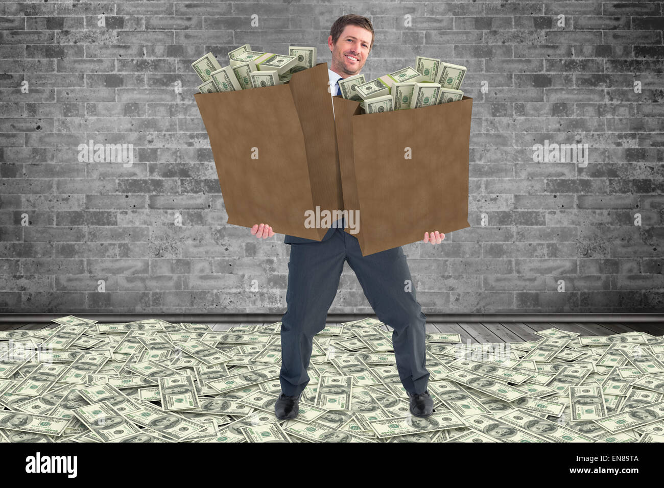 composite-image-of-businessman-carrying-bags-of-dollars-EN89TA.jpg