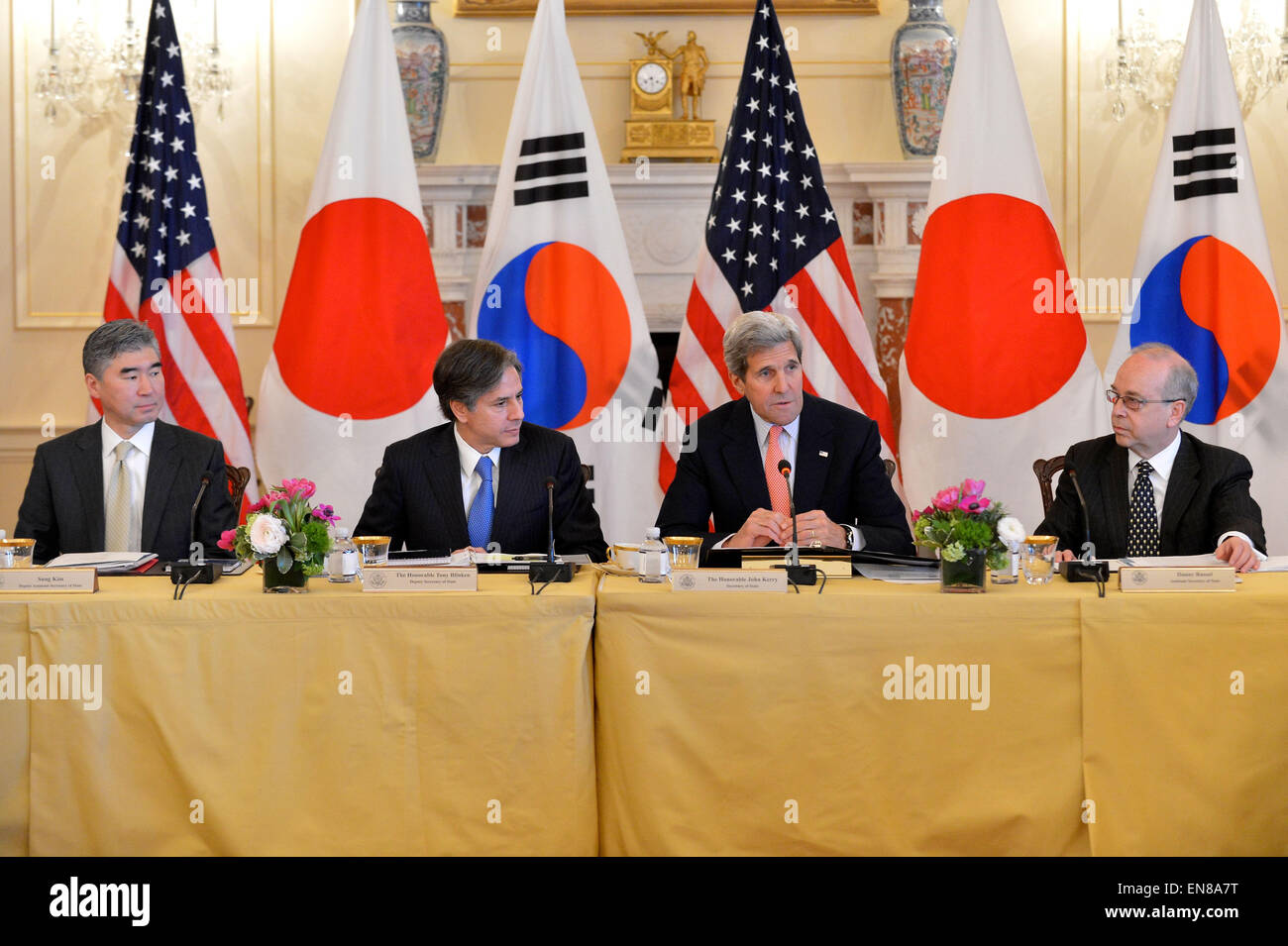 U.S. Secretary of State John Kerry joins Deputy Secretary of State Tony Blinken's meeting with his counterparts, Japanese Vice Foreign Minister Akitaka Saiki and Republic of Korea Vice Foreign Minister Cho Tae-yong, at the U.S. Department of State in Washington, D.C., on April 15, 2015. Also pictured are Ambassador Sung Kim, Special Representative for North Korea Policy, and Assistant Secretary of State for East Asian and Pacific Affairs Danny Russel. Stock Photo