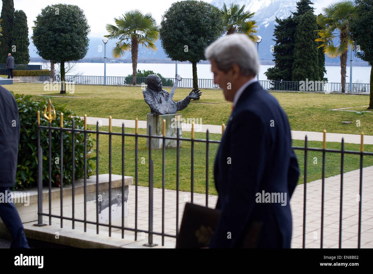 U.S. Secretary of State John Kerry passes a bust of blues guitarist B.B. King in Montreux, Switzerland, home of the annual Montreux Jazz Festival, after concluding a meeting on March 4, 2015, with Iranian Foreign Minister Javad Zarif about the future of his country's nuclear program. Stock Photo
