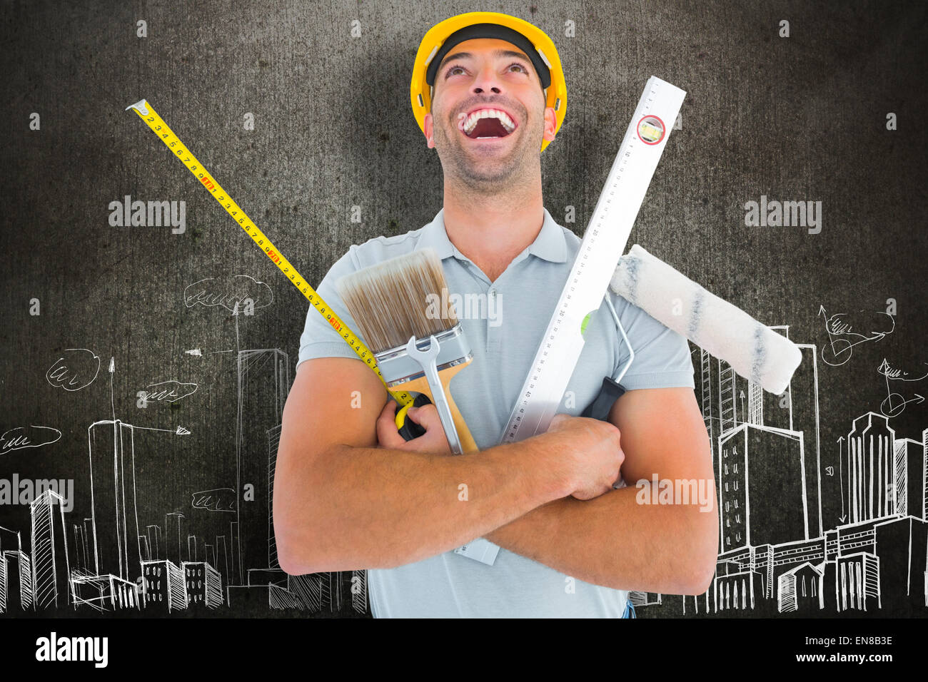 Composite image of laughing manual worker holding various tools Stock Photo