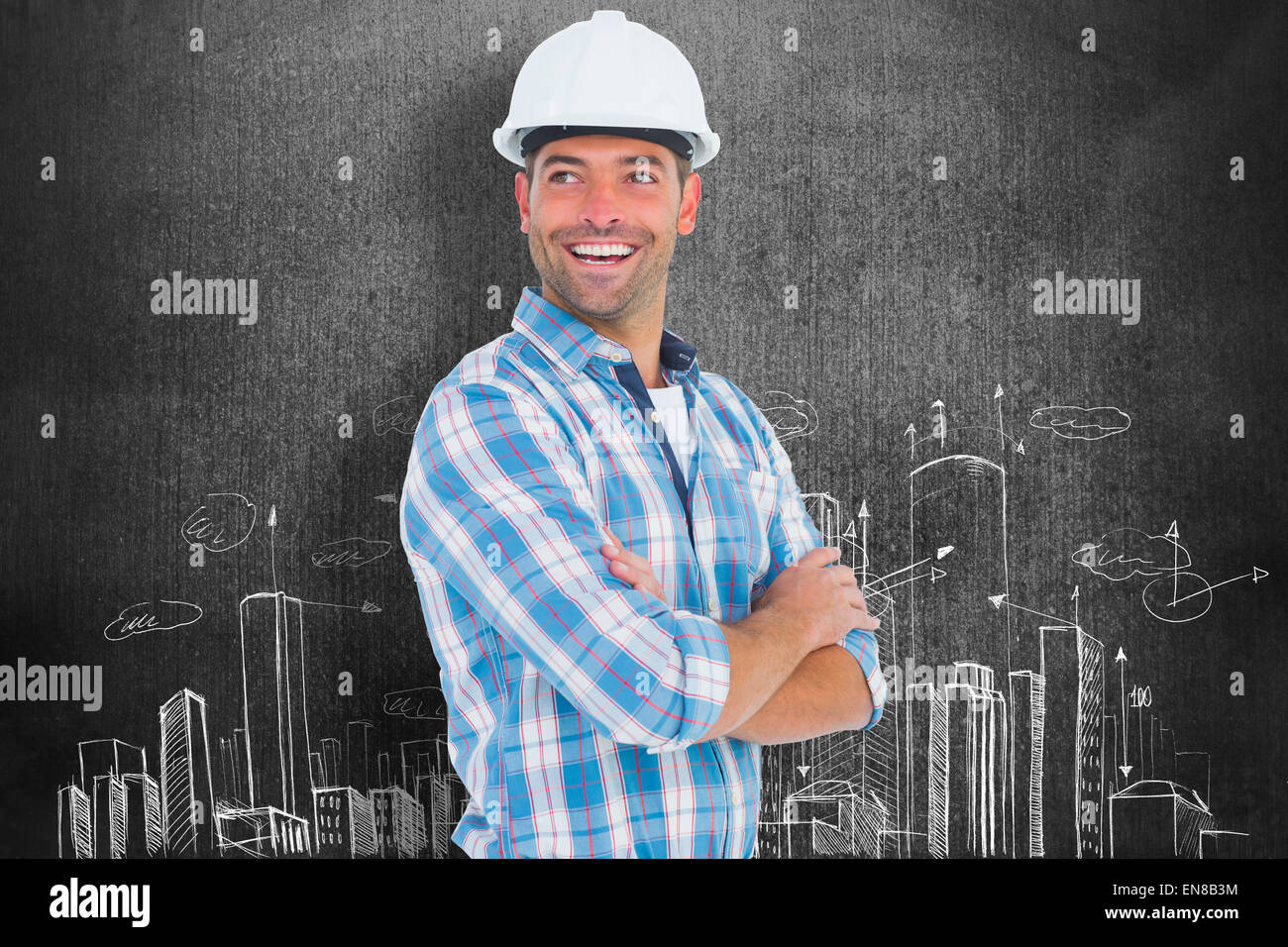 Composite image of smiling male worker standing arms crossed Stock Photo