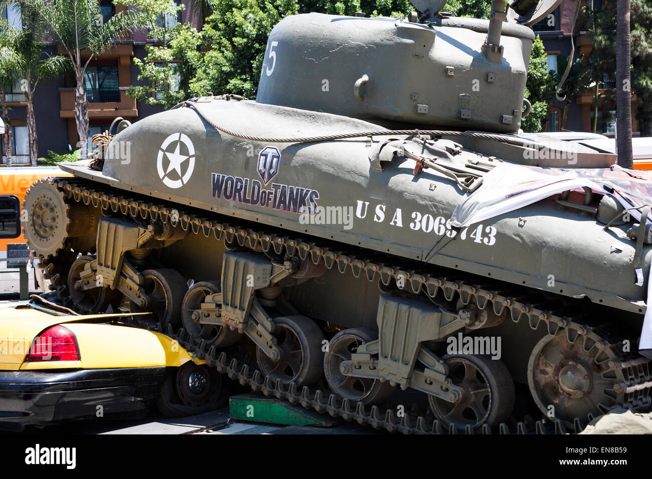 A full size replica of a World War 2 tank as featured in the video game crushing a taxi cab in front of the 2014 E3 Expo. Stock Photo