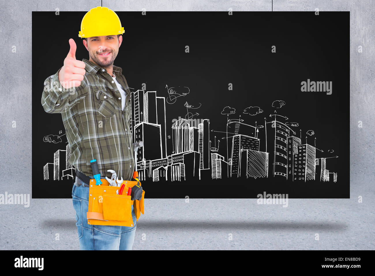 Composite image of confident manual worker gesturing thumb up Stock Photo