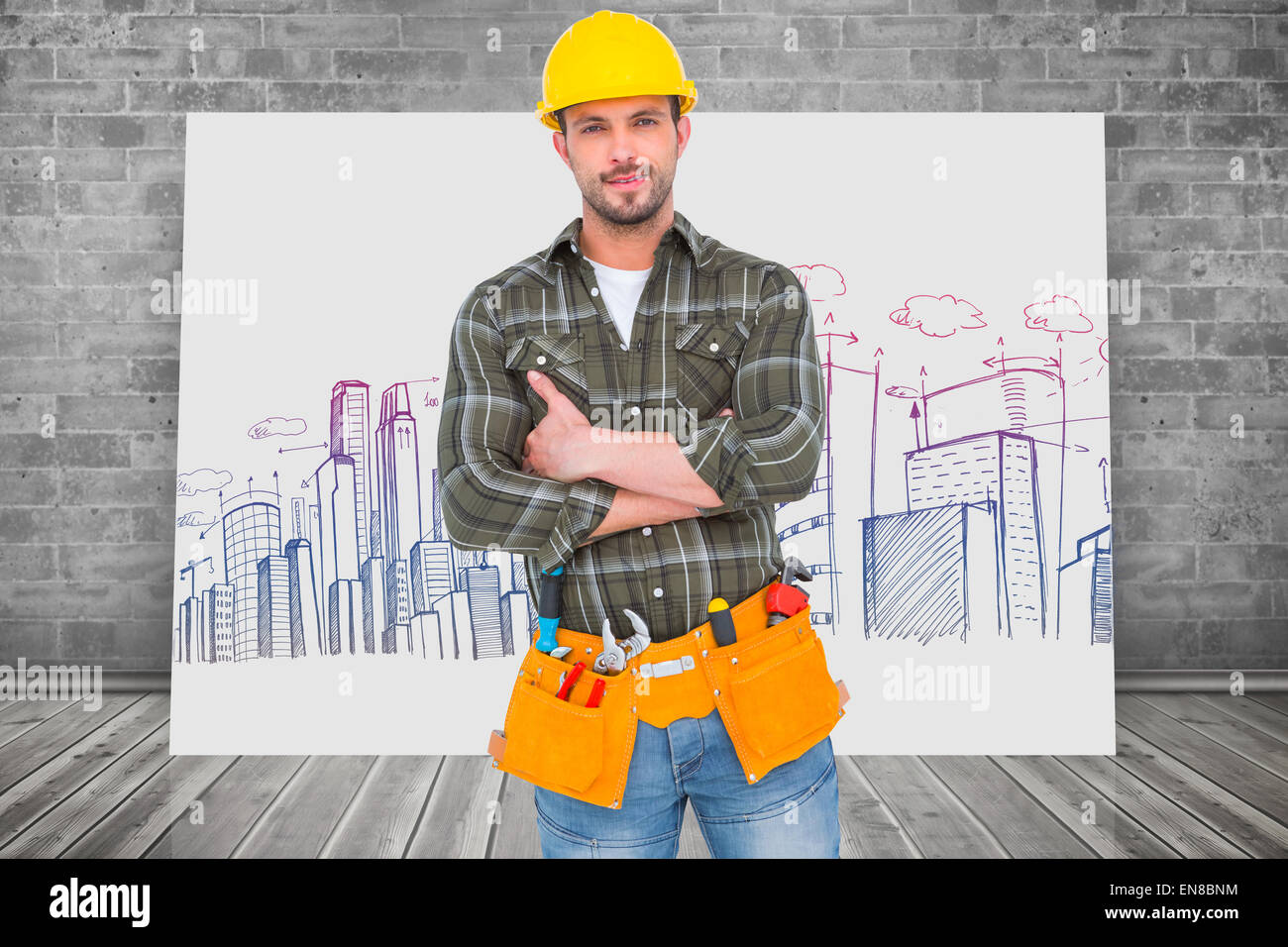 Composite image of manual worker with tool belt Stock Photo