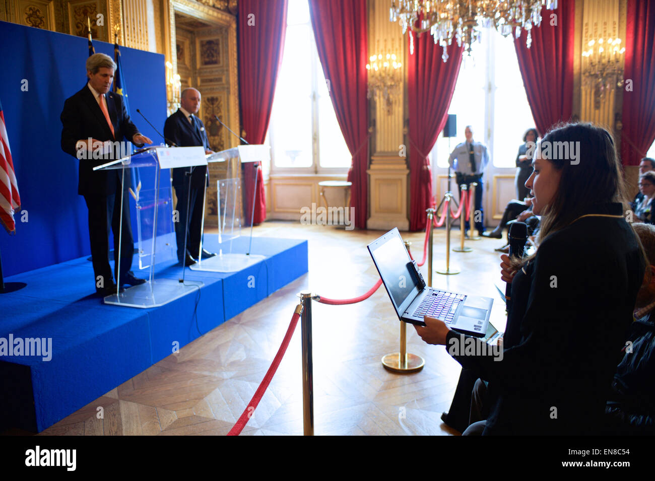 Felicia Schwartz of The Wall Street Journal questions U.S. Secretary of State John Kerry and French Foreign Minister Laurent Fabius during a joint news conference on March 7, 2015, in the Quai d'Orsay - the French Foreign Minister building - in Paris, France, following a bilateral meeting focused on the Secretary's recent Iran nuclear negotiations, his meeting with the Gulf Cooperation Council in Saudi Arabia, Ukraine, and other regional issues. Stock Photo