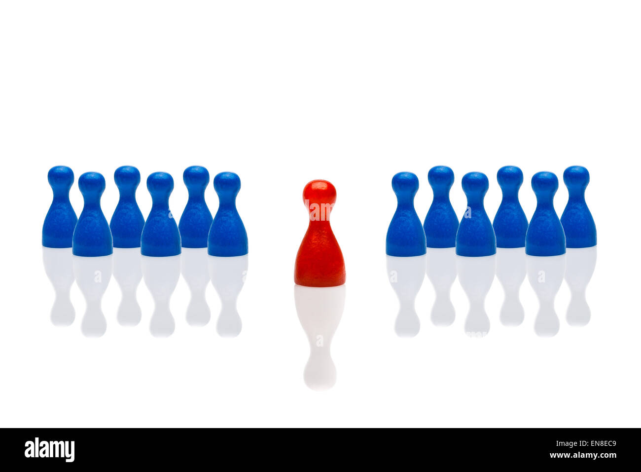 Business concept for leadership team, leadership, step forward. Multiple blue pawn figures, red one in front. Isolated on white Stock Photo