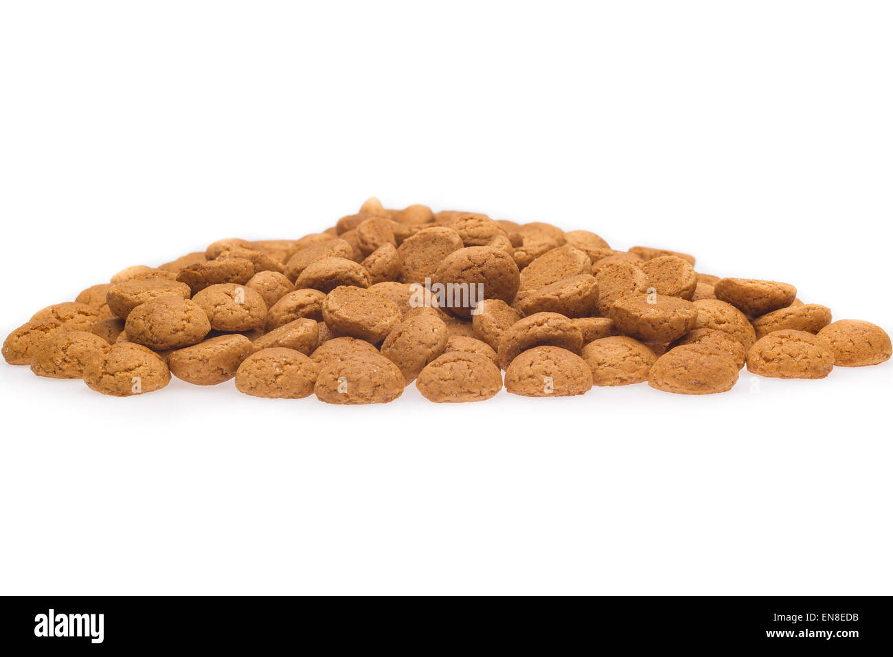 A lot of pepernoten, traditional dutch treat for Sinterklaas event on 5 december. Isolated on white background. Front view. Stock Photo