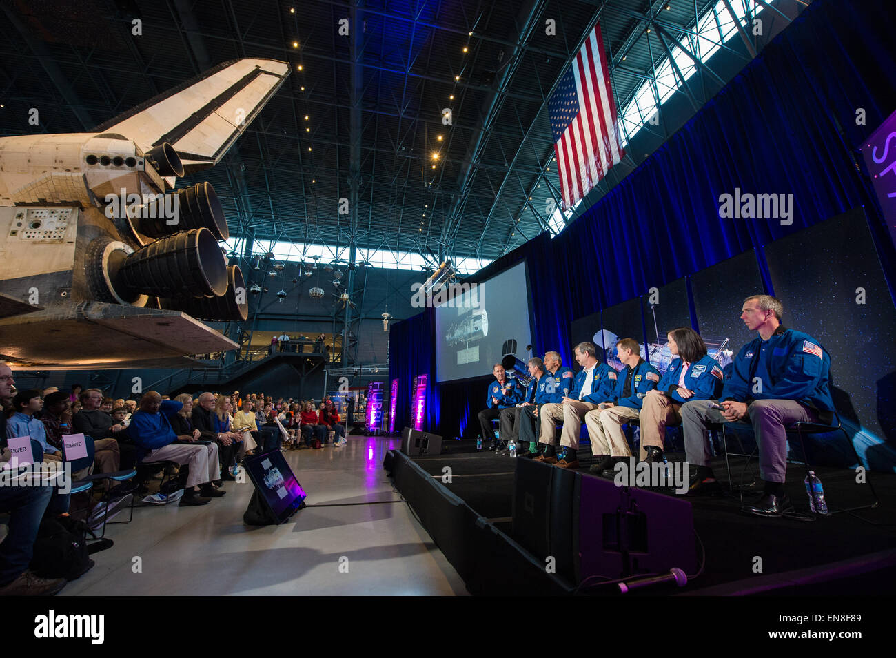 The crew of STS-125, the final Hubble Servicing Mission, participate in a panel discussion as part of an event celebrating the 25th Anniversary of the Hubble Space Telescope, Saturday, April 25, 2015 at the Smithsonian's Steven F. Udvar-Hazy Center in Chantilly, Va.  From left: former NASA astronauts John Grunsfeld, Michael T. Good, Mike Massimino, Scott Altman, Gregory C. Johnson, and current NASA astronauts Megan McArthur Behnken and Andrew Feustel. Stock Photo