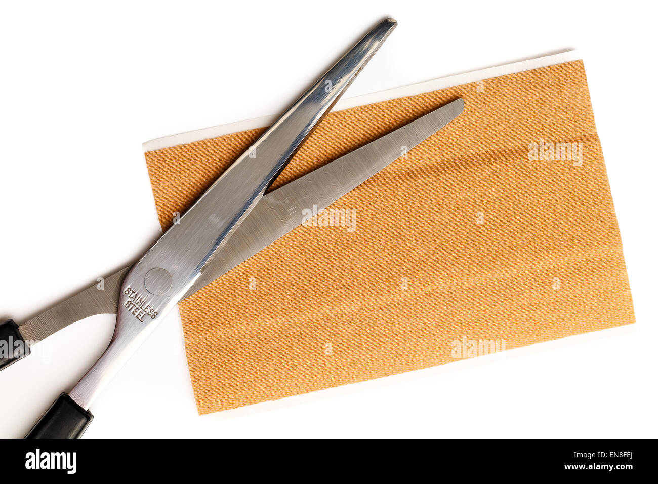 Strip of band aid with scissors isolated on a white background. Cure