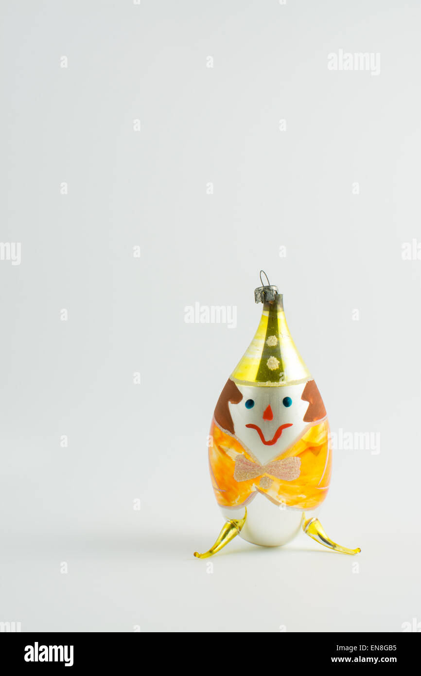 Vintage glass christmas bauble - yellow clown character Stock Photo