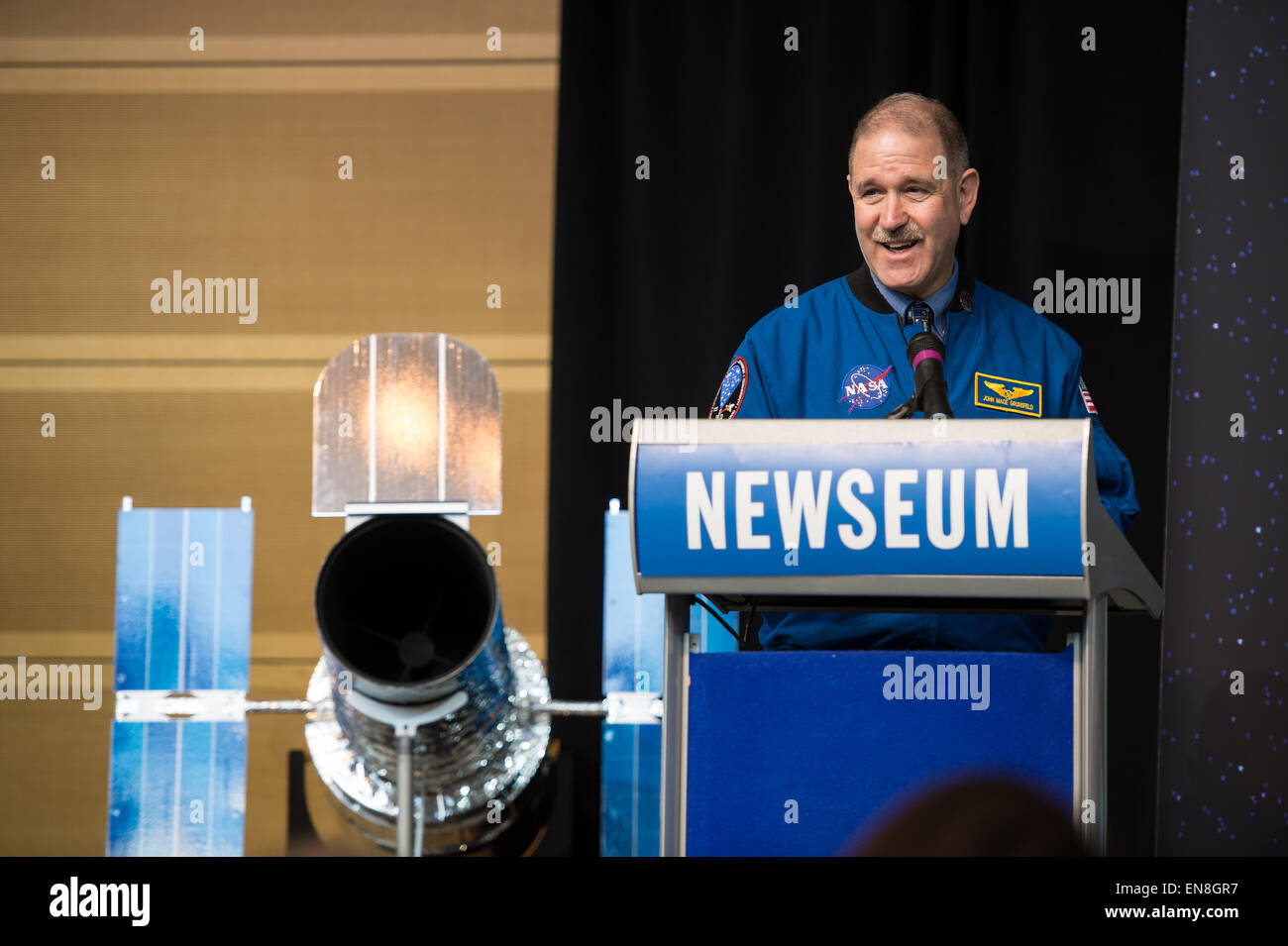 John Grunsfeld, associate administrator, Science Mission Directorate, NASA, speaks at the Hubble 25th Anniversary official image debut event on Thursday, April 23, 2015 at the Newseum in Washington, DC. The official image from Hubble's near-infrared Wide Field Camera 3 is of a two million year old cluster of about 3,000 stars called Westerlund 2, named after the astronomer who discovered it in the 1960s. Westerlund 2 is located in the constellation Carina about 20,000 light-years away from Earth. Stock Photo