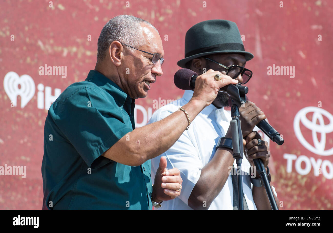 NASA Administrator Charles Bolden, left, is seen on stage with will.i.am during the Global Citizen 2015 Earth Day event on Saturday, April 18, 2015 on the Washington Monument Grounds in Washington, DC.  Administrator Bolden and will.i.am highlighted how the agency is using space based sensing to better understand how our planet works, how we affect it, and how it might change in the future. Stock Photo