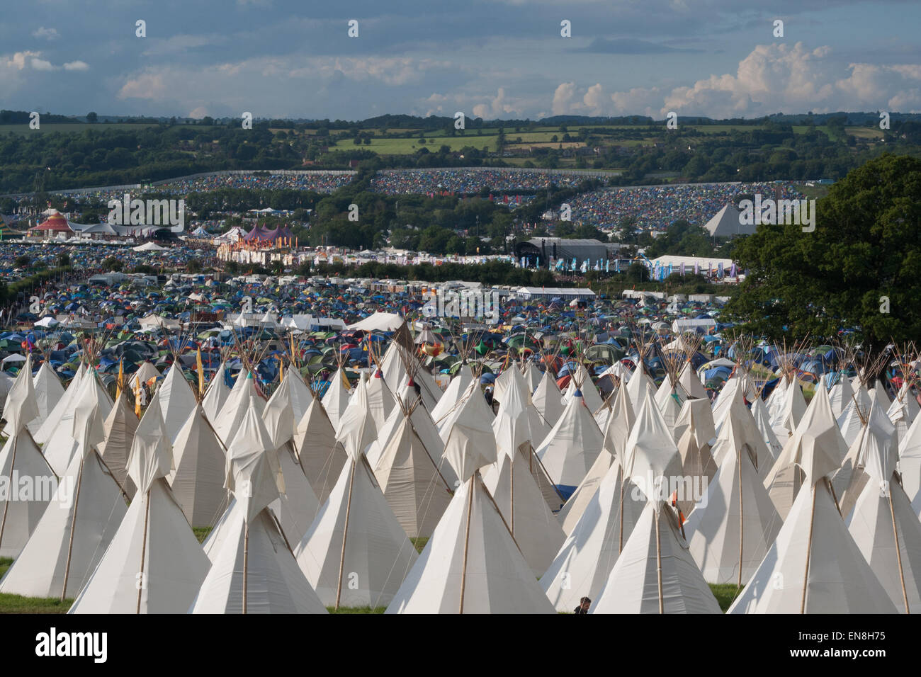 GLASTONBURY, UK - JUNE 28: Tipi tents at Glastonbury Festival on 28th June, 2014 at Pilton Farm, Somerset. Stock Photo