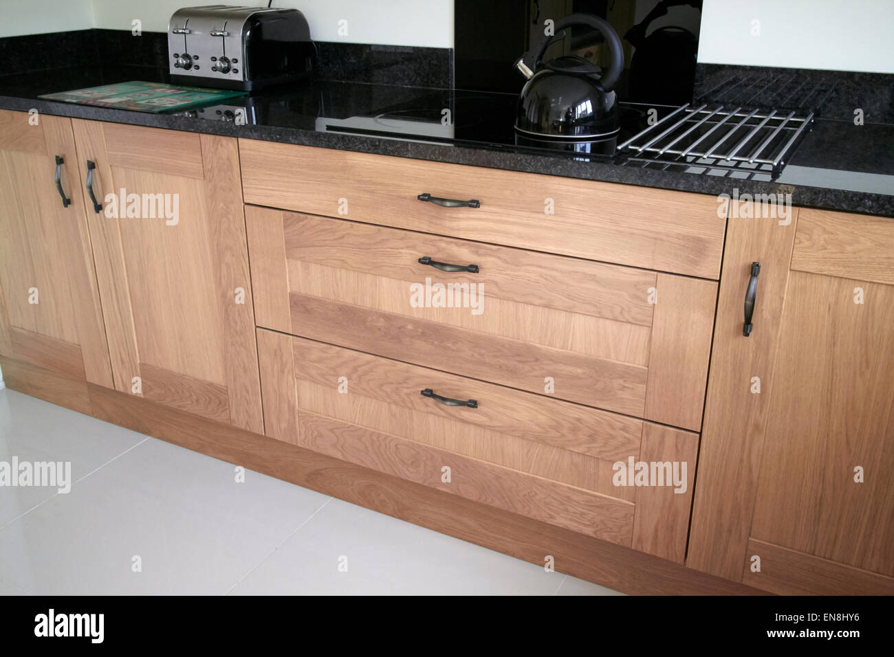 brand new kitchen cabinets and granite worktops in a new build property in the uk Stock Photo