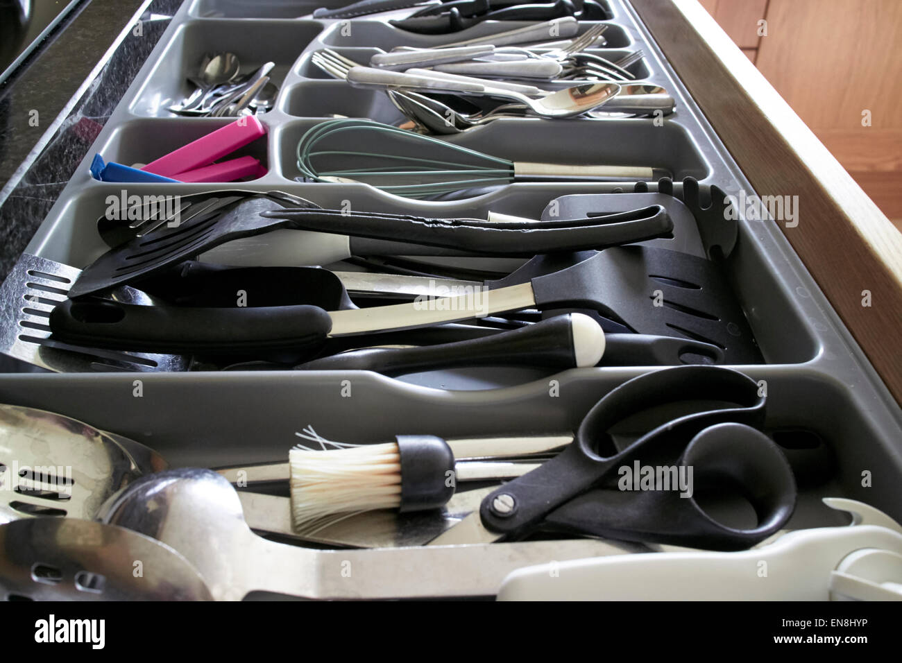 cutlery drawer full of utensils Stock Photo