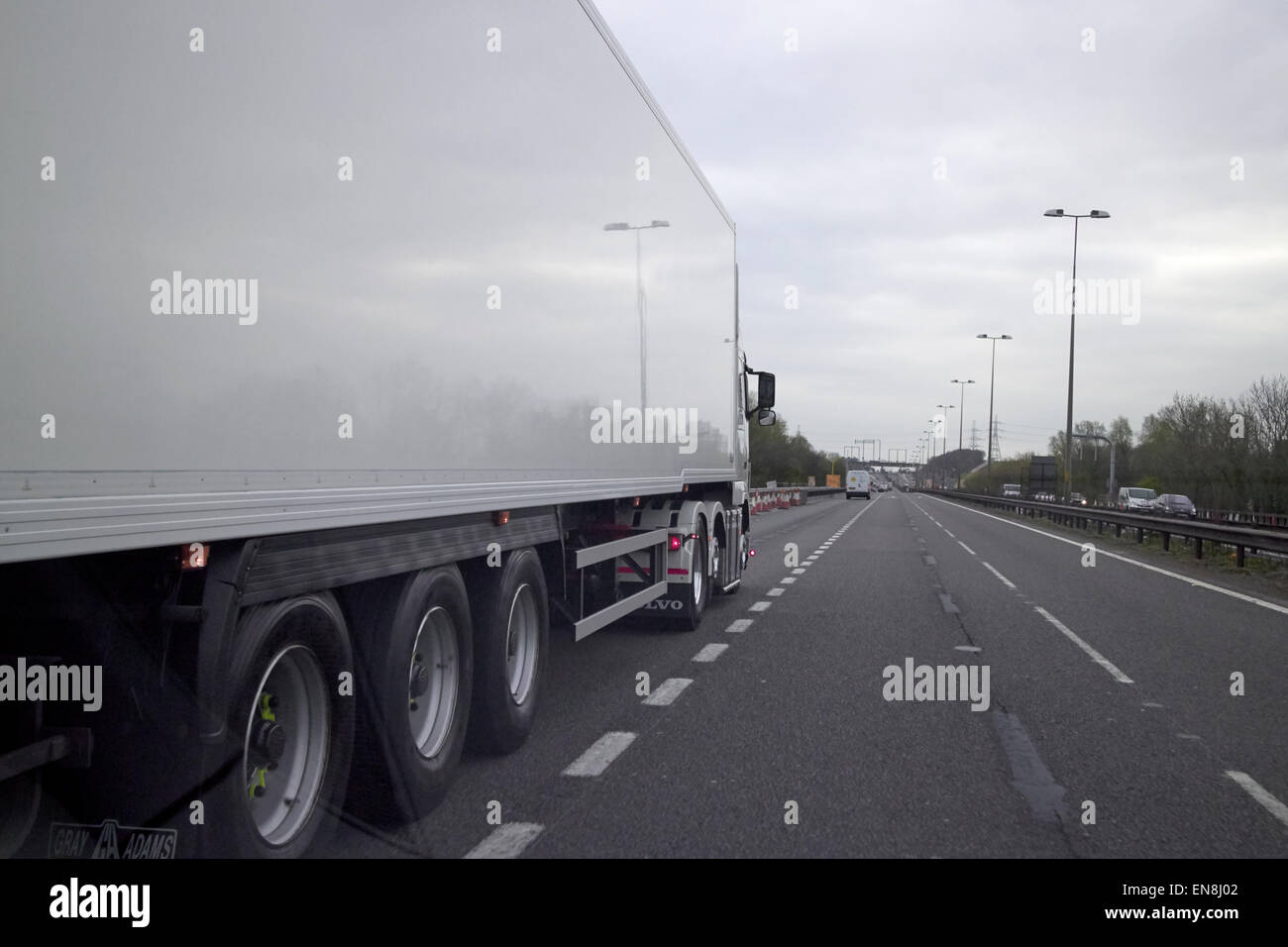 overtaking articulated lorry truck on the m6 motorway england uk Stock Photo