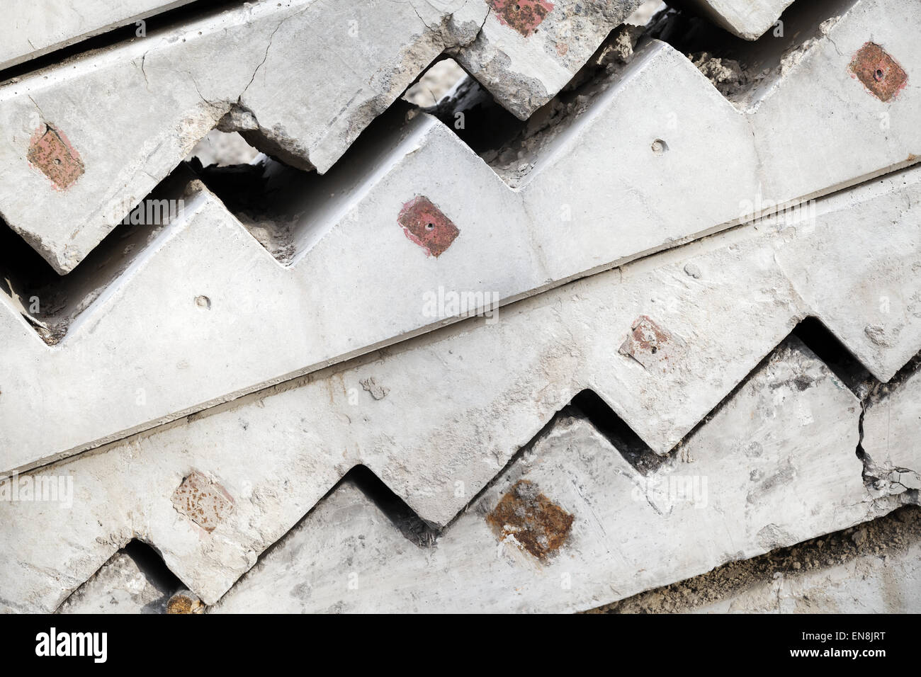 Abstract industrial construction background. Gray concrete stairway elements are stacked outdoor Stock Photo