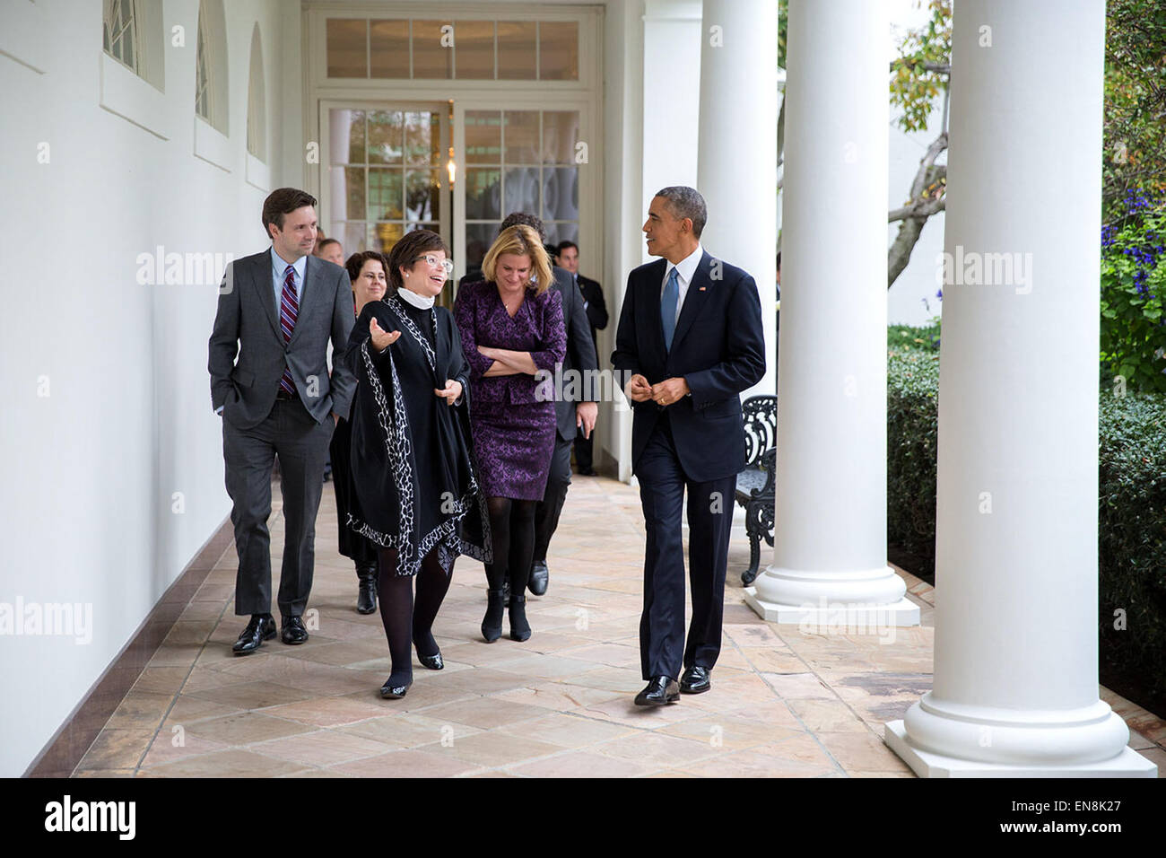 President Barack Obama walks on the Colonnade with, from left, Press Secretary Josh Earnest, Cecilia Mu–oz, Domestic Policy Council Director, Senior Advisor Valerie Jarrett and Jennifer Palmieri, Director of Communications, following a press conference in the East Room of the White House, Nov. 5, 2014. Stock Photo