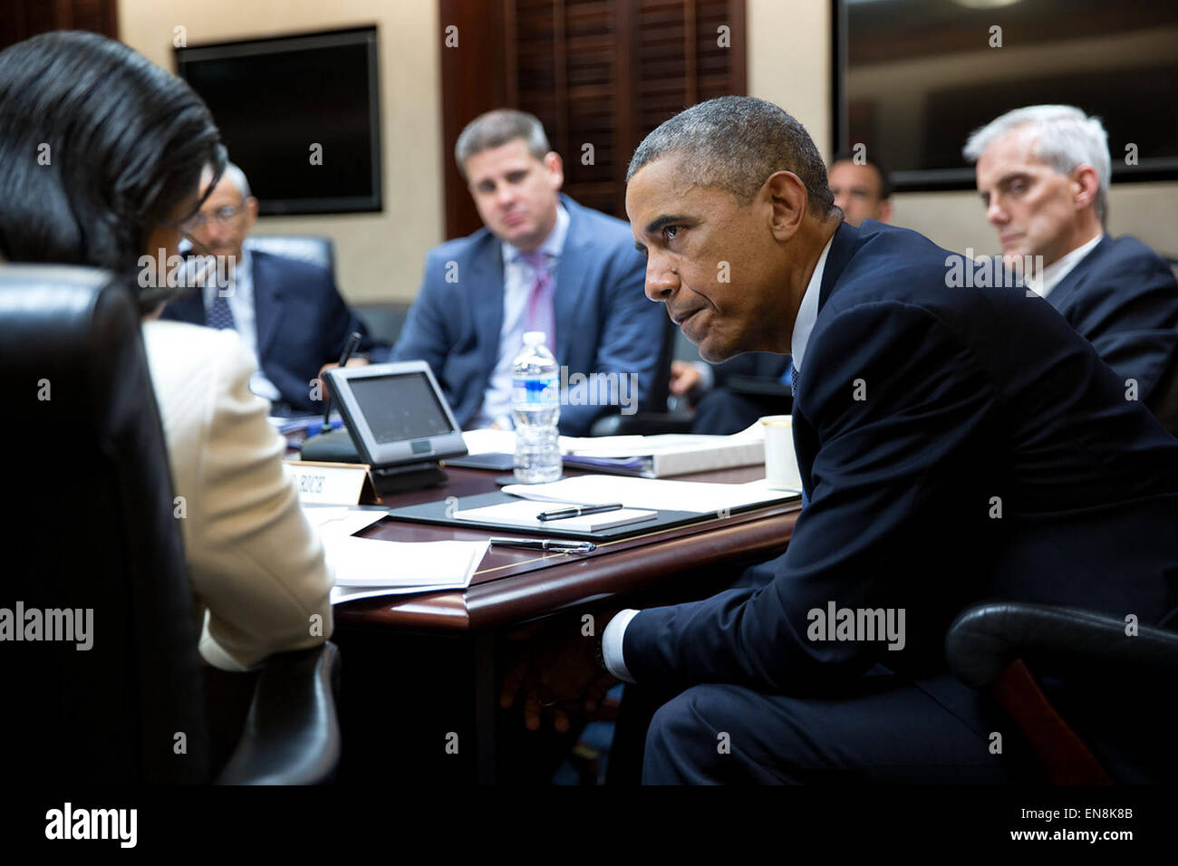 President Barack Obama listens to National Security Advisor Susan E ...