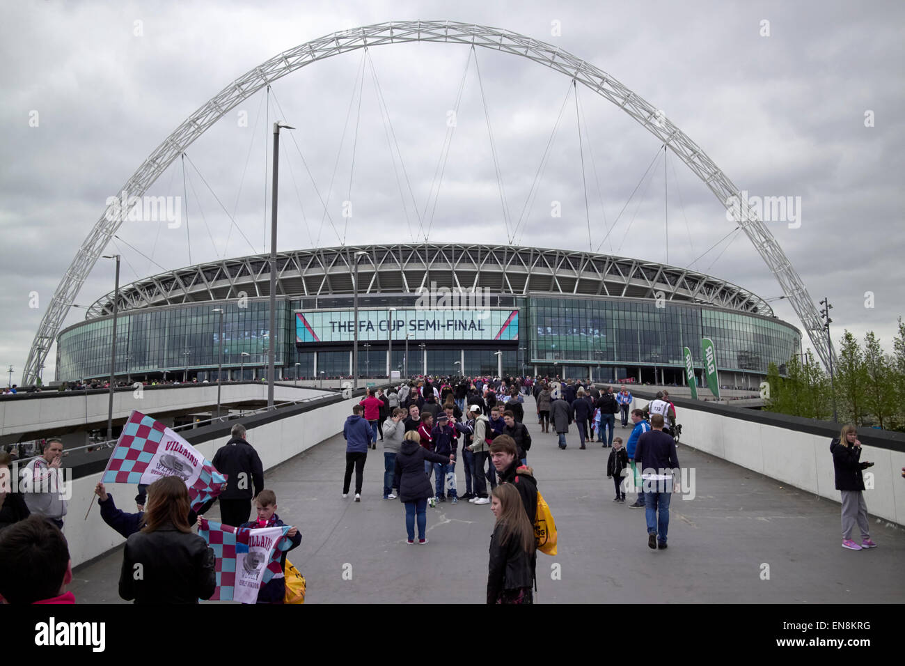 aston villa fans approach Wembley stadium on fa cup semi final day London UK Stock Photo